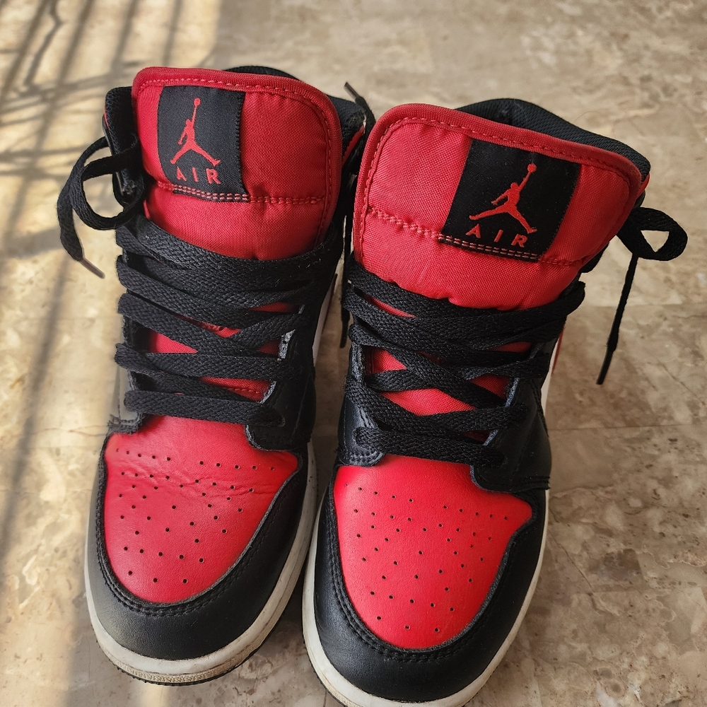 Jordan 1 mids black white and red